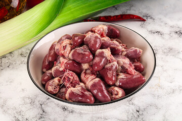 Raw chicken hearts in the bowl