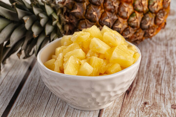 Sweet canned pineapple fruit pieces