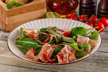 Salad with jamon, strawberry and arugula