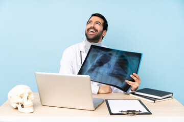 Professional traumatologist in workplace happy and smiling