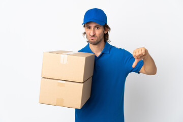 Delivery man isolated on white background showing thumb down with negative expression