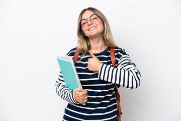 Young student Rumanian woman isolated on white background giving a thumbs up gesture