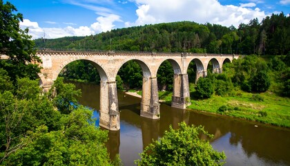 Fototapeta premium Scenic railway bridge over a river
