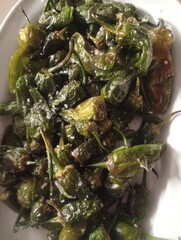 plate of fried traditional Spanish Tapas, Padron Peppers