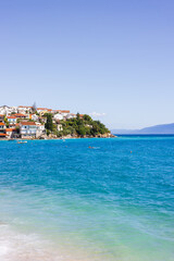 Village Podaca on the Adriatic coast. Makarska Riviera, South Dalmatia, Croatia. Photo of the village washed by the turquoise waters of the Adriatic Sea, surrounded by mountains. 