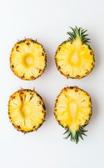 Four Slices Of Pineapple On A Plain Background