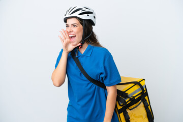 Young delivery woman with thermal backpack isolated on white background shouting with mouth wide...