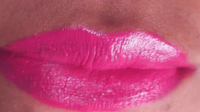 Close up Macro of Indian teenage girl lips doing various types of expressions. lift, Frown, grimace, moue, scowl, pout, Kiss, smooch, smack, peck, graze, caress, skim