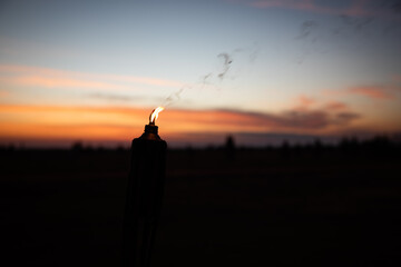 candle burning sunset bug deterent