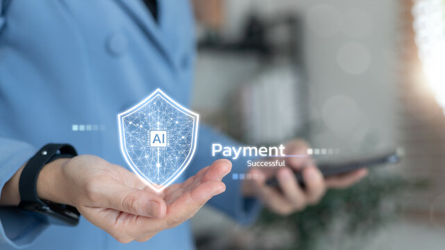 Person holding hologram AI shield with payment successful text, representing artificial intelligence in secure digital payment and fintech technology.