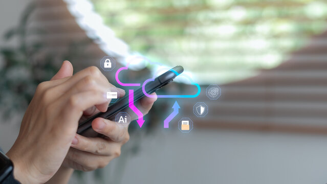 Person using smartphone with hologram cloud, AI, and security icons, representing cloud computing, data storage, and artificial intelligence technology. - Powered by Adobe