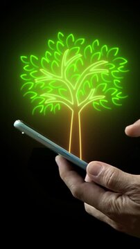Businessman shows virtual tree icon glowing on smartphone. Net zero greenhouse gas emissions target. Climate neutral long term strategy. Ecological, renewable energy and save environment concept.