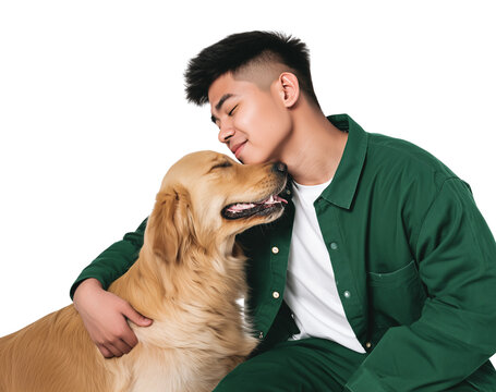 Young man hugging a golden retriever dog in a studio setting