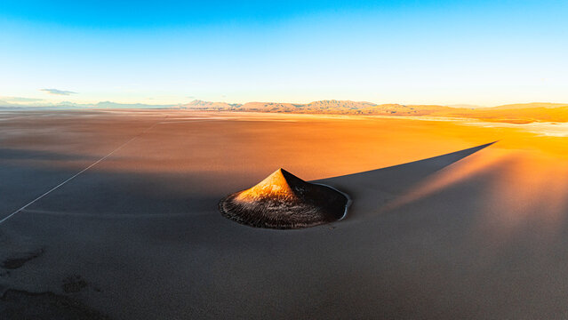 Arita volcanic cone at sunset, aerial view