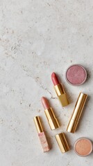 Lipsticks And Blush On Marble Background. Elegant Makeup Products For Beauty And Fashion