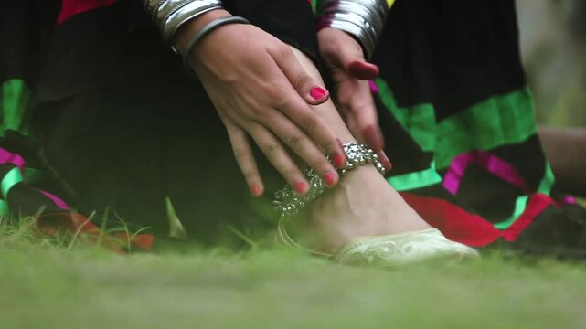 Closeup shot of women leg wearing anklet.