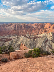 Dramatic canyon landscape with layered cliffs and rocky terrain at upheaval dome, canyonlands national park.