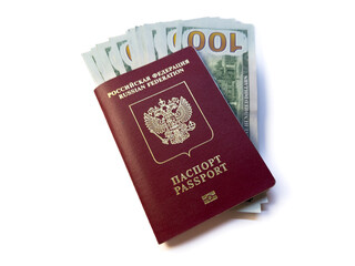 Russian passport and hundred dollar bills. Entry tax to the USA, visa fee, visa tax, deposit of money in the USA upon entry. immigration emigration visa us, visa USA, copy space, flat lay, top view. H
