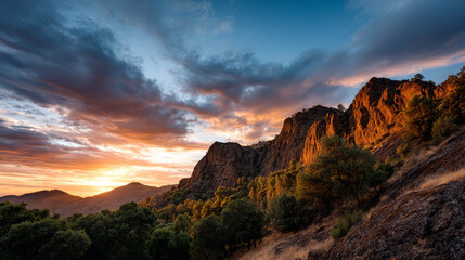 Fototapeta premium Mountain view above clouds flowers and blooming bushes at sunset sunbeams. Calm close-up beautiful landscape, screensaver background, Beautiful panorama. Summer vacation, holiday, amazing nature.