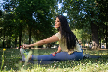 Woman, fitness and stretching legs outdoor in city for healthy body, flexible and exercise for...
