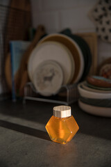  Jar of honey on the table in the kitchen