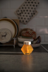 Jar of honey on the table in the kitchen