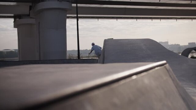 Aggressive inline skater jumps onto ramp at high speed