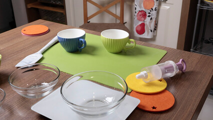 Process of preparing scales and dishes for dough preparation. Objects on wooden table. 