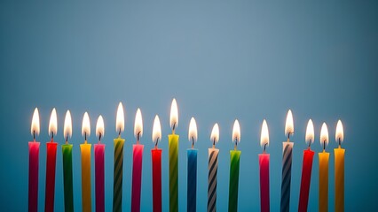 Colorful birthday candles with glowing flames, creating a festive and celebratory atmosphere.