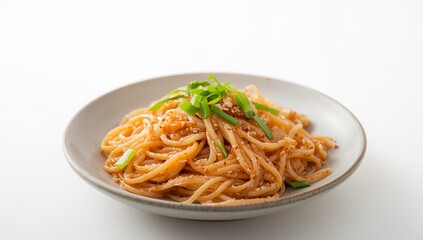 Delicious Asian Noodles with Sesame Seeds and Scallions on a White Background.