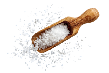 A wooden scoop filled with fine sea salt, surrounded by scattered grains. This image highlights the texture and natural element of salt in culinary use.