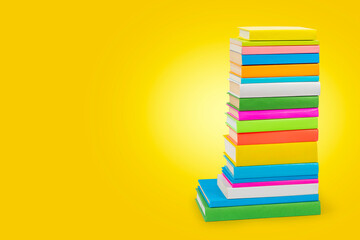 Books in multi-colored covers. Literature for children. Collection in the library. Textbooks for...