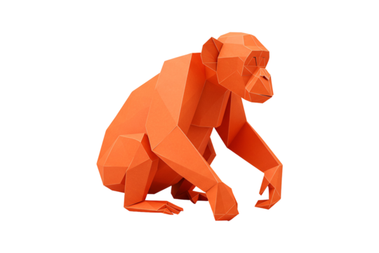 Geometric orange origami monkey figure poised in a creative studio setting