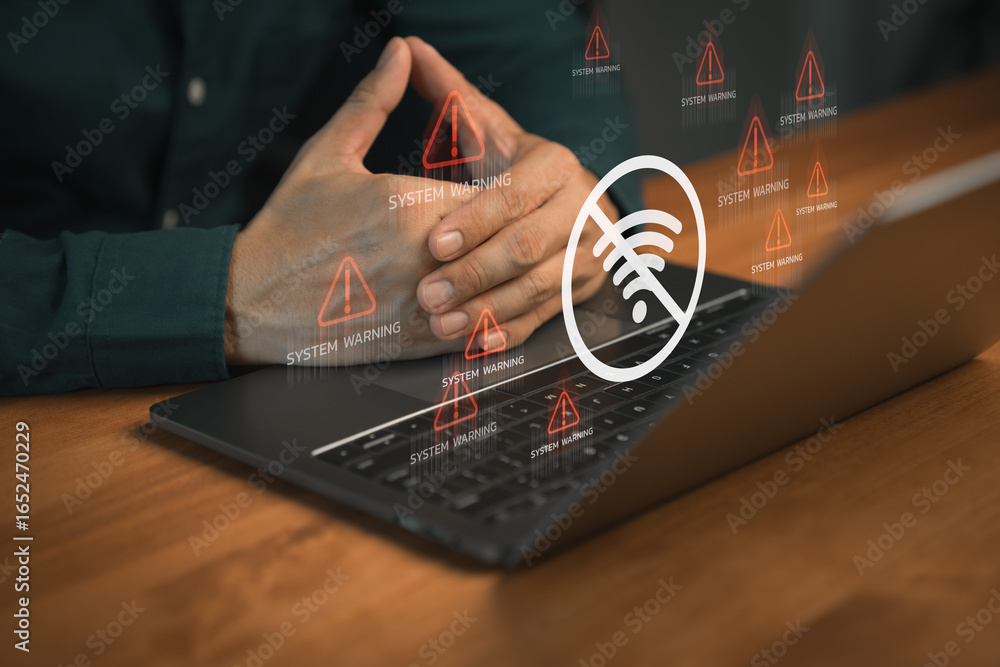 Poster person using laptop computer with warning icon and a no wi-fi signal symbol. idea for it security se