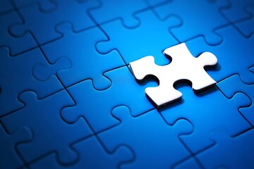A single white puzzle piece stands out against a dark blue background of assembled puzzle pieces symbolizing uniqueness and individuality
