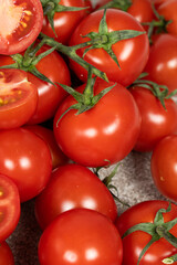 Lots of ripe fresh cocktail tomatoes close-up.