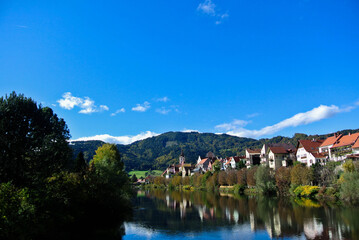 Fototapeta premium Frohnleiten Austria with Mountain View and River Reflection