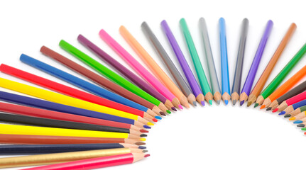 Colorful pencils arranged in a fan shape on white background