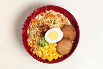 A unique twist on classic Indomie: this bowl of creamy noodle soup is rich with milk, making it a comforting and modern Indonesian fusion dish.