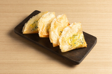 Martabak telur is an Indonesian street food favorite: a crispy, pan-fried pastry filled with a savory mix of beef, egg, and spring onion.
