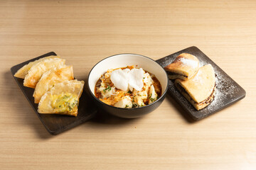 A delicious spread of Indonesian culinary delights: the crispy Tahu Kupat with its sweet and savory sauce, fluffy Martabak Manis, and savory Martabak Telur