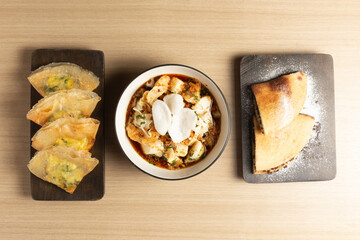 A delicious spread of Indonesian culinary delights: the crispy Tahu Kupat with its sweet and savory sauce, fluffy Martabak Manis, and savory Martabak Telur