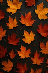 Fototapeta premium A Stunning Arrangement of Vibrantly Colored Autumn Leaves on a Dark Background, Capturing the Essence of Fall Foliage in Nature's Palette