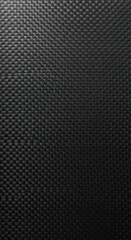 Naklejka premium Detailed close-up of black interwoven textured material with subtle light play