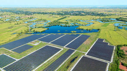 Drone shot aerial view solar energy array provides renewable power in large scale facility...