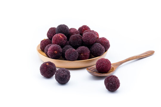 Fresh Chinese bayberries on a white background