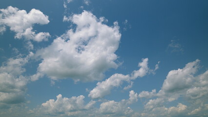Time lapse. A Relaxing Blue Sky with Fluffy Clouds That Creates a Peaceful and Beautiful Atmosphere...
