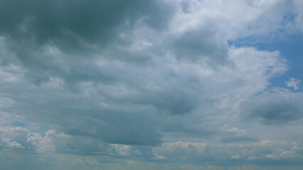 A Dynamic Cloud Formation is Creating Beautiful and Intricate Patterns Over a Bright Blue Sky