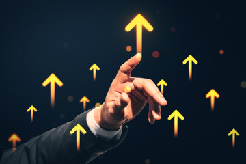 Businessman's hand pressing upward glowing arrows symbolizing growth and success on dark virtual background with futuristic interface elements.