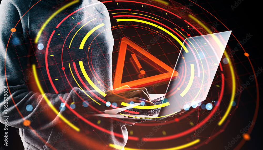 Poster cybersecurity warning concept showing person using a laptop with digital alert icon and glowing red 